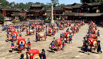 Miao ethnic people play drums to celebrate autumn harvest in SW China